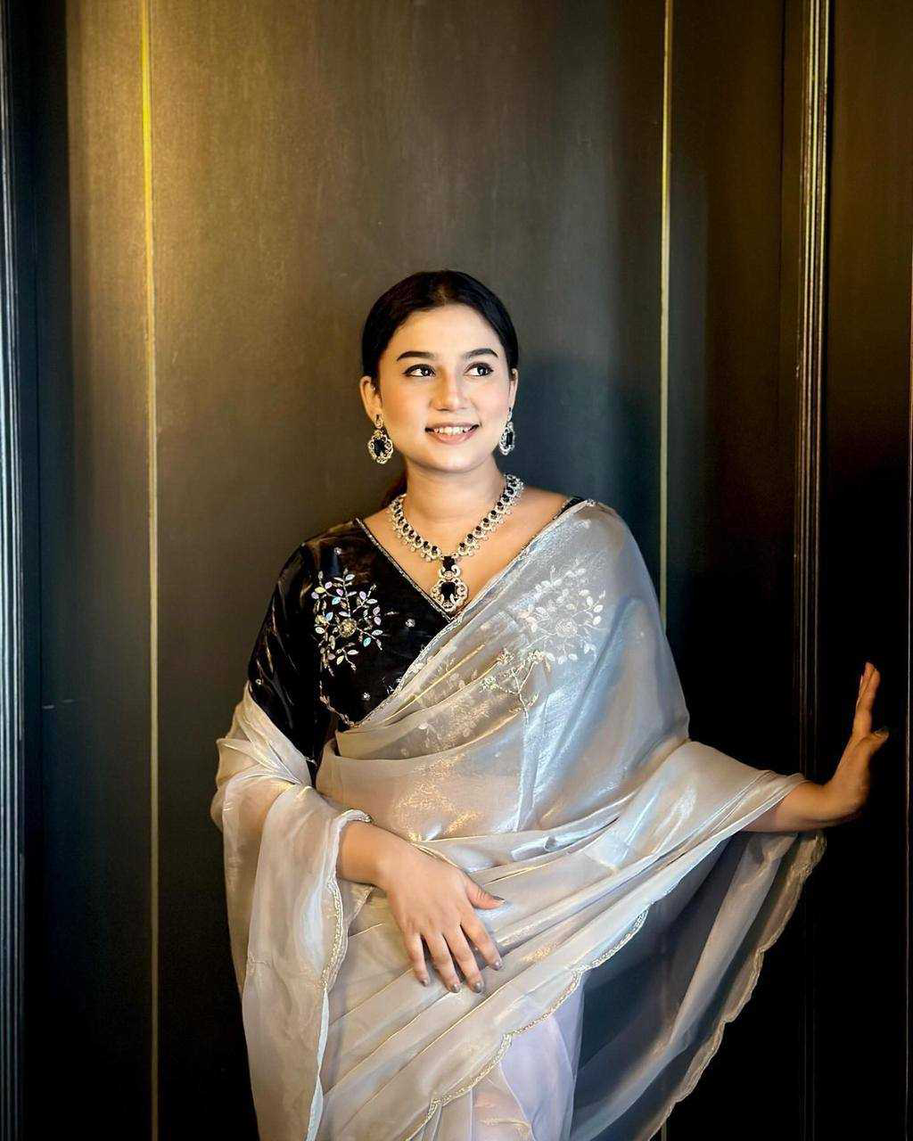 Soft Jimmy Chuu Fabric With Heavy Handwork Butta All Over Saree Moti, Sequence And Cutdana Attached With Two Layer Of Cutdana And Arco Border